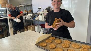 Family recipe. Rebecca Walker with a tray of freshly baked Anzac biscuits. Beca Bakes will be open from 4am Anzac Day for coffee and a family recipe biscuit. Picture Heath Forsyth 