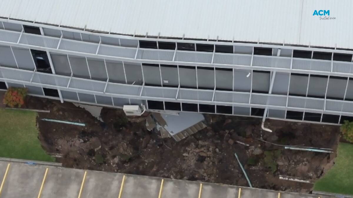 Emergency services on the scene at the Rockdale office building where a sinkhole has emerged. Picture NSW Fire and Rescue