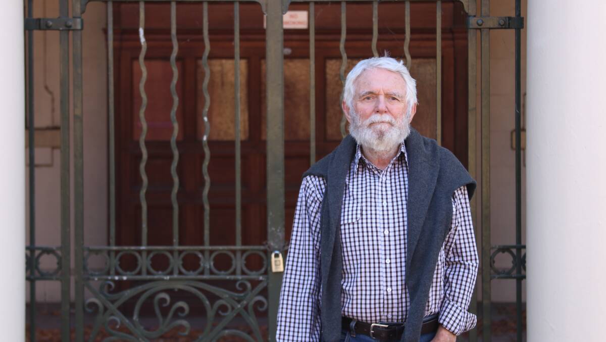 Gordon Cope from the group Armidale live standing outside the locked old Armidale courthouse in the Beardy Street Mall.