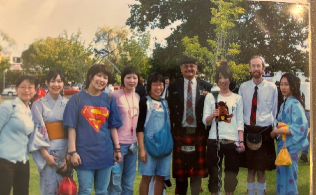 Japanese exchange students Yurie (third from right) and Manaka (far left) with their Armidale host John Cameron (4th from right). Taken at Civic Park, Armidale, for the Autumn festival in March 2005 Picture provided