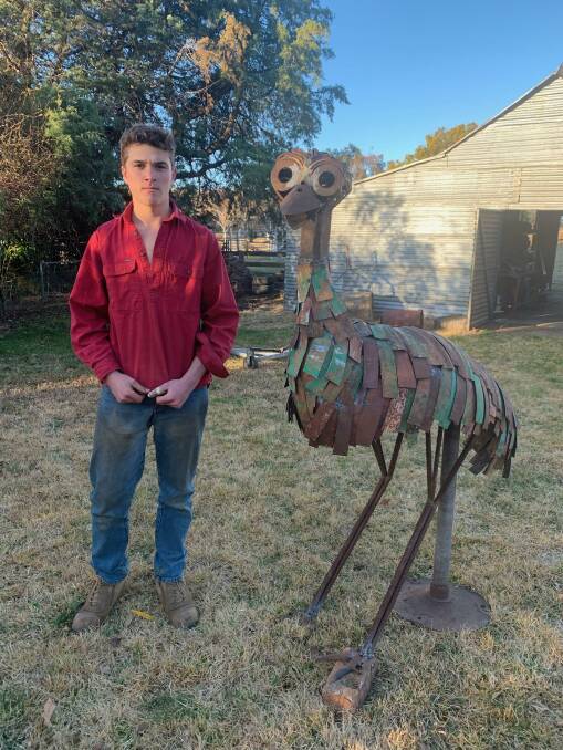 Jack McCook with his Sculpture 'Dinawan'. Jack's work is being considered for a major prize at this year's Sculpture in the Garden at Mudgee, Photo supplied.