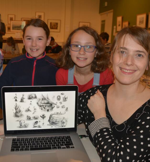 ILLUSTRATED:  Lauren Williams, Catalina Cox and Kate Matthews at the New England Regional Art Museum's Shaun Tan workshop. The city's youngsters learned about animation and then designed their own short film on the day.