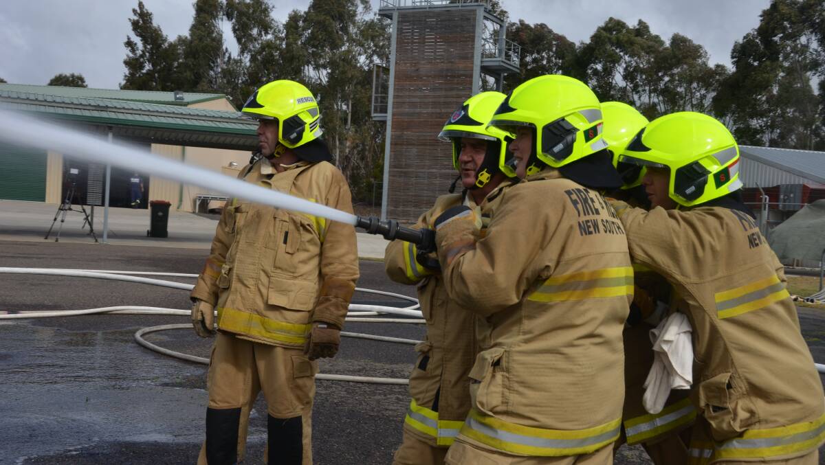 BLAZE OF GLORY: Recruit firefighters during a hose drill for their final training block at the Armidale Fire and Rescue Training Centre.