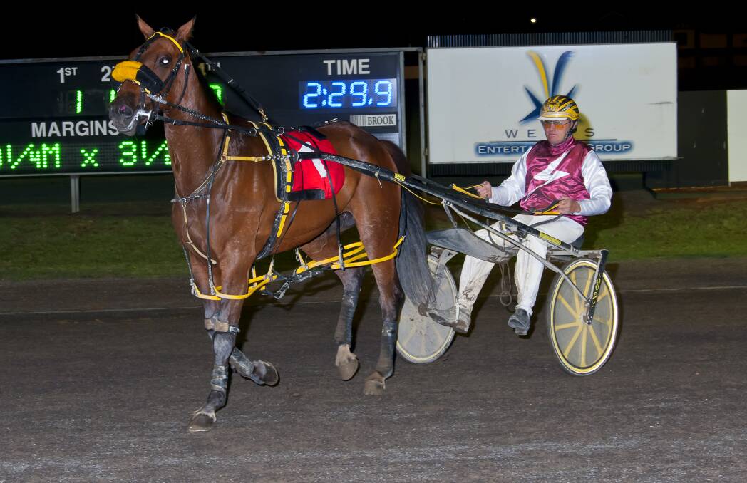 Winner winner: Uralla trainer Mitch Faulkner took out the Christmas Gift at the Tamworth Harness Club on Friday night as part of a winning double. Photo: PeterMac