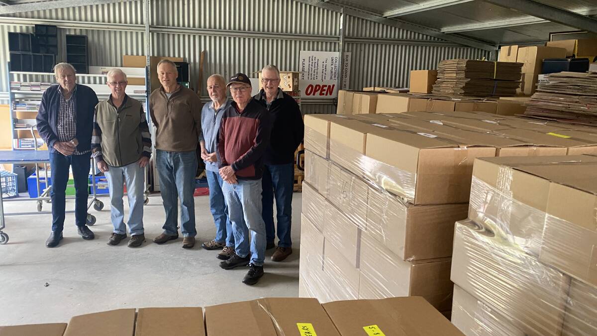 Terry Inman, Ian Garske, Andrew Pratt, Dick McCarthy, Hans Voskuyl and Graeme Miller with the boxes of books. Picture by Laurie Bullock