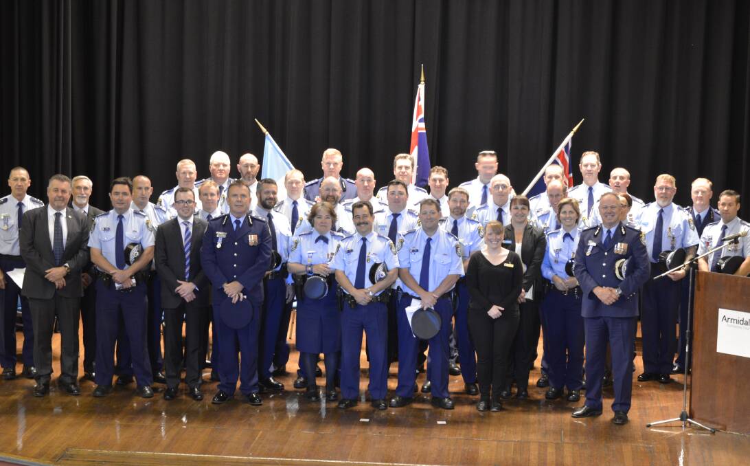 Centre stage: A group of officers and special guests taking the stage for the New England Local Area Command Awards Ceremony on Wednesday to honour the brave men and women who dedicate their lives on the front line.