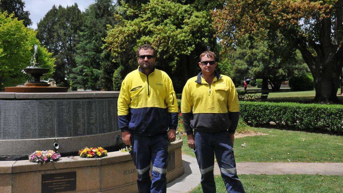 Fed up: Council workers Josh Deiderick and Nick Adams had to clean up after vandals on Remembrance Day.