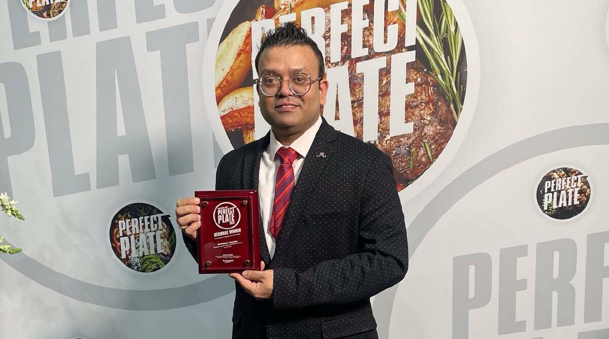 Armidale Ex Services Club head chef Shibojyoti Basak with the regional award for the Clubs NSW Perfect Plate competition. Picture supplied.