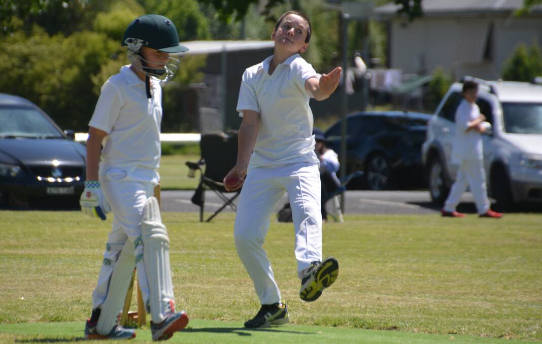 Andrew Pearson bowling in a junior cricket match.
