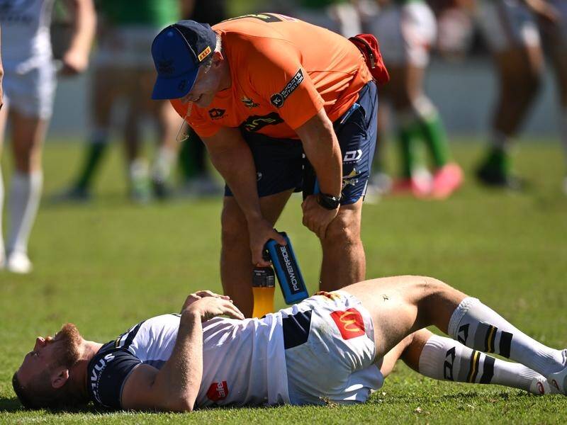 North Queensland forward Coen Hess in agony after tearing his right ACL against Canberra. (Lukas Coch/AAP PHOTOS)