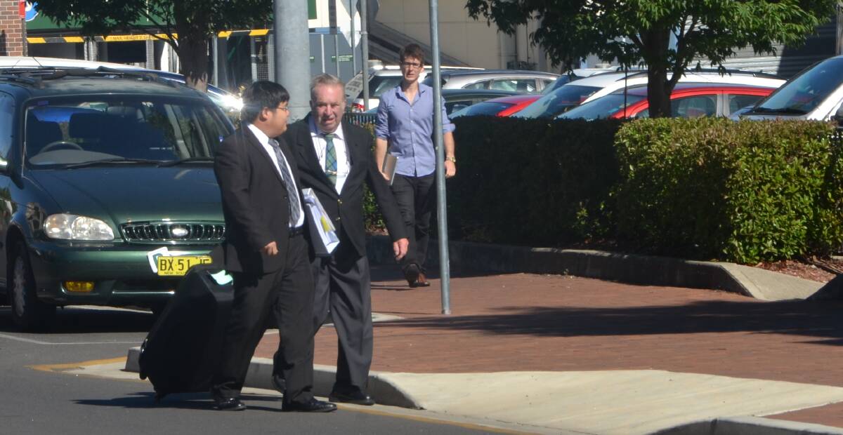 AWAITING SENTENCING: John Ferris and his solicitor outside Armidale Local Court before he was taken into custody earlier this year.