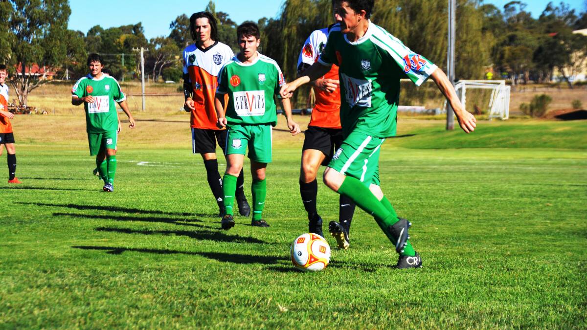 GOING FOR GOAL: East Armidale Football Club’s Nathan Gwynne looks to get a kick away in their win in the season opener against Tamworth’s North Companions FC at Doody Park on Saturday afternoon. 